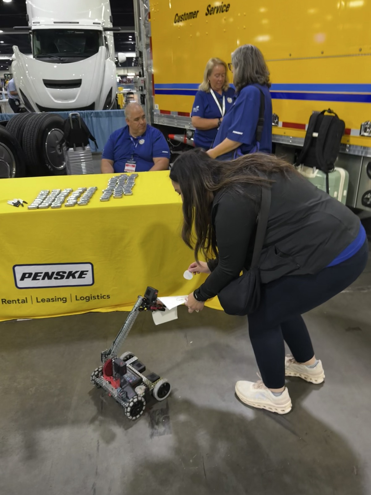 A participant exploring a robotics demonstration at SkillsUSA.